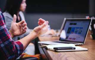 Person at a computer explaining