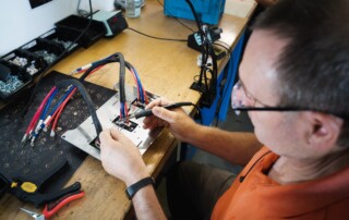 engineer in lab soldering