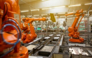 a factory filled with industrial robots