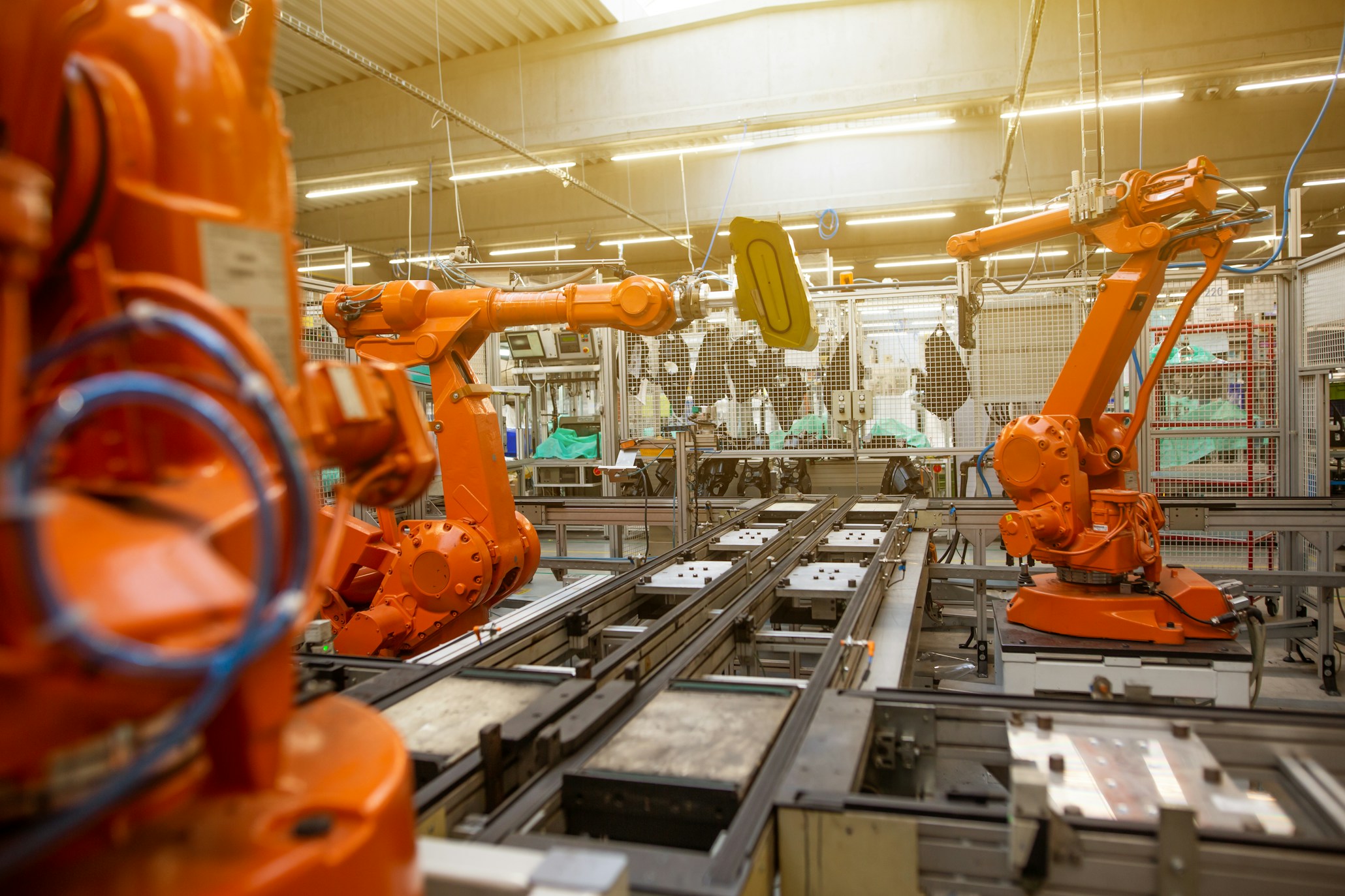 a factory filled with industrial robots